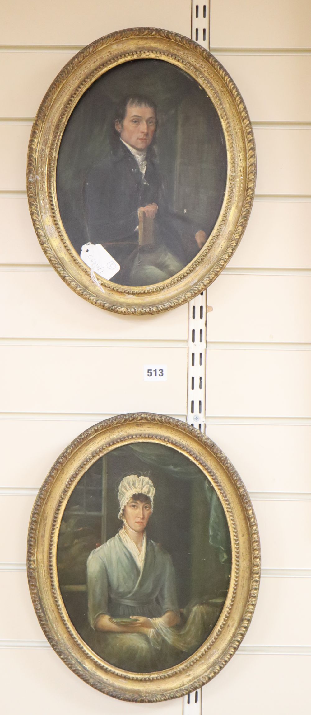 English School, pair of oils on panel, Half length portraits of a seated lady and gentleman, 30 x 23cm